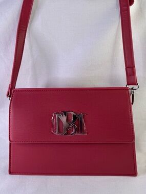 Red Monogram lined Crossbody Bag by Badgley Mischka.
